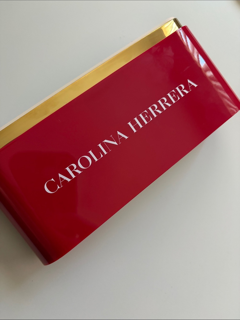 Carolina Herrera Red and Gold Decorative display plaque